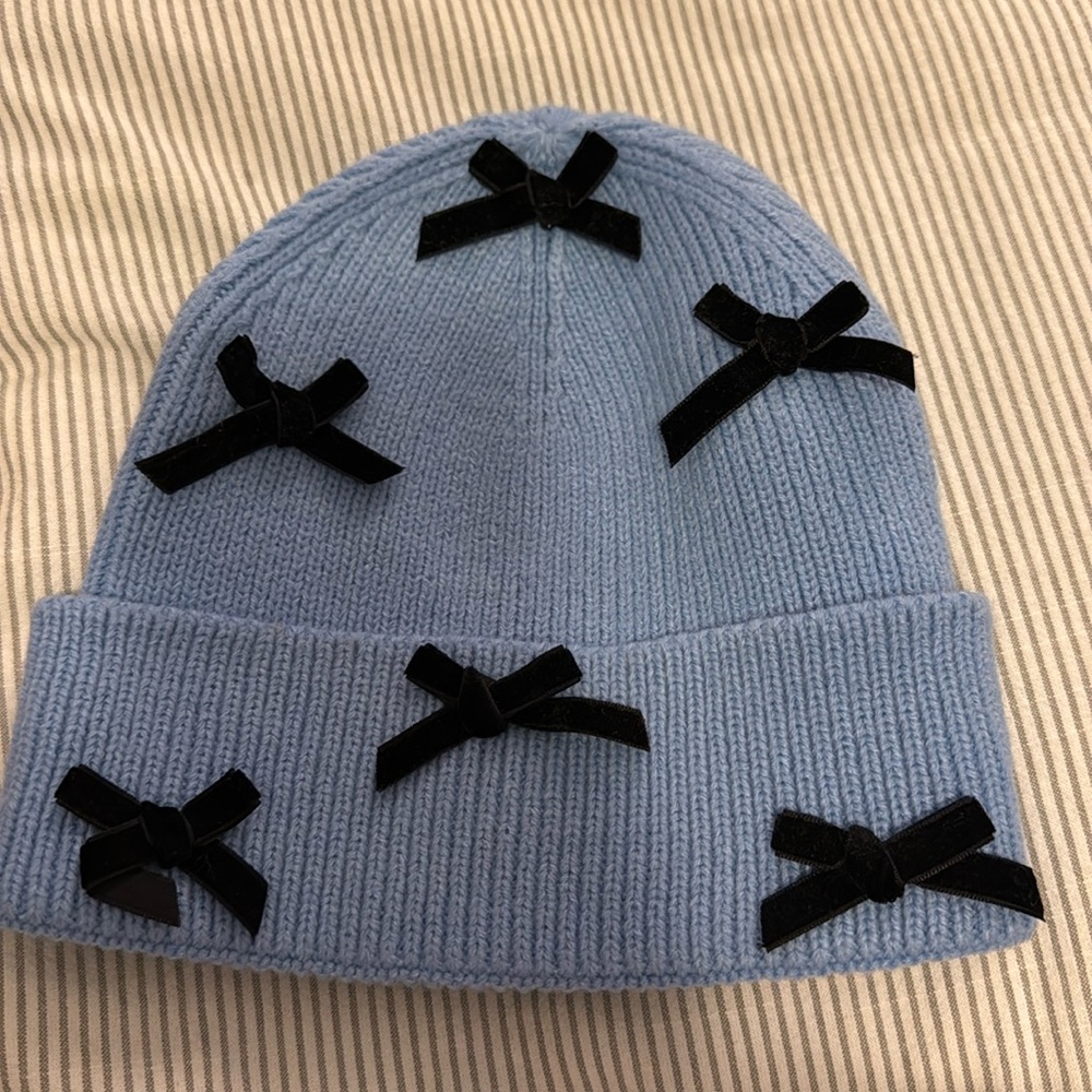 Baby blue beanie with black bows brand Olivia and Kate